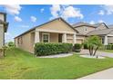 View of home's side exterior and well-manicured lawn with desert landscaping at 11308 Chilly Water Ct, Riverview, FL 33569