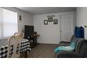 Comfortable living area with wood floors and neutral decor at 11907 Frontage Rd, Dade City, FL 33525
