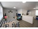Bright living space with a dining area and a view into the kitchen at 11907 Frontage Rd, Dade City, FL 33525