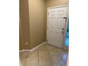 Inviting entryway featuring neutral paint and tile flooring leading into the home's interior at 19239 Stone Hedge Dr, Tampa, FL 33647