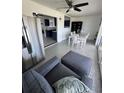 Open living space featuring modern furniture, tile flooring and adjoined dining area at 2306 41St E St, Bradenton, FL 34208