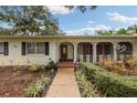 Charming porch with decorative railings and a well-maintained front yard at 3108 S Omar Ave, Tampa, FL 33629