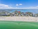 Aerial shot of condo on beach with ocean views and surrounding cityscape at 5353 Gulf Blvd # A402, St Pete Beach, FL 33706