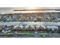 Expansive aerial view of waterfront condos with private boat docks providing easy access to the bay and Gulf of Mexico at 610 Pinellas Bayway S # 5202, Tierra Verde, FL 33715