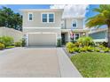 Charming two-story home with well-maintained landscaping, large driveway and a two car garage at 8050 Praise Dr, Tampa, FL 33625