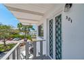 Balcony view of white condo building featuring a decorative railing at 8396 111Th St # 301, Seminole, FL 33772