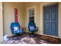 Inviting front porch with comfortable seating, perfect for enjoying the outdoors at 9317 Stone River Pl, Riverview, FL 33578