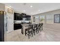 Modern kitchen with granite countertops, stainless steel appliances, and a convenient center island at 11464 Chilly Water Ct, Riverview, FL 33569