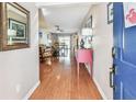 Inviting foyer with wood floors leading into the home's open living spaces at 12413 Dawn Vista Dr, Riverview, FL 33578