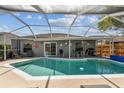Relaxing pool area with lounge chairs and covered patio, ideal for enjoying sunny days at 12413 Dawn Vista Dr, Riverview, FL 33578