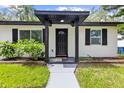 Close-up of inviting front porch and entry of a single-story home at 1275 Palm St, Clearwater, FL 33755