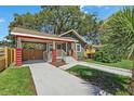 Inviting single-Gathering home showcasing a covered entryway and well-maintained landscaping at 1435 Prescott S St, St Petersburg, FL 33712
