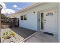 Welcoming front entrance with a modern door and decorative privacy screen at 2 79Th S St, St Petersburg, FL 33707