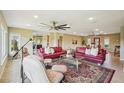 A spacious living room showcases a large rug, stylish sofas, and plenty of natural light at 2110 W View Dr, Sun City Center, FL 33573