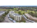 A multi-story condo building offering golf course views with covered parking at 225 Country Club Dr # 1506, Largo, FL 33771