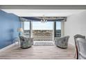Sitting area with water view, balcony access, and stylish decor at 31 Island Way # 406, Clearwater Beach, FL 33767