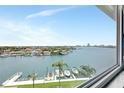 Breathtaking water view from the condo's window, overlooking boats and the city skyline at 31 Island Way # 406, Clearwater Beach, FL 33767