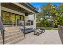 Inviting outdoor patio featuring a built-in grill, comfortable seating, and a cozy fire pit for entertaining at 503 W Davis Blvd, Tampa, FL 33606