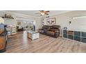 Bright living room featuring wood floors, neutral paint, and a seamless open floorplan at 6167 31St Ave, St Petersburg, FL 33710