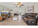 Open-concept living room featuring wood floors, neutral paint, and plenty of space to relax at 6167 31St Ave, St Petersburg, FL 33710