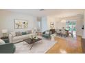 Bright and airy living room featuring hardwood floors and an open floor plan at 6237 50Th N Ave, St Petersburg, FL 33709