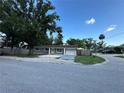Inviting single-story home with lush landscaping and a spacious driveway at 12009 Washington St, Seffner, FL 33584