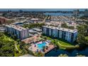 Aerial view of the Pasadena Cove pool, hot tub, and common area near the water at 1324 Pasadena S Ave # 501, South Pasadena, FL 33707