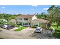 Charming two-story townhome with ample parking and well-maintained landscaping at 15636 Morning Dr, Lutz, FL 33559
