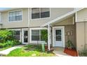 Charming townhouse exterior with well-maintained landscaping and a welcoming front entrance on a sunny day at 15636 Morning Dr, Lutz, FL 33559