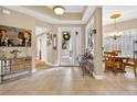 Bright foyer with tile floors, artwork, front door with glass, and furniture at 15744 Crystal Waters Dr, Wimauma, FL 33598