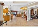 Open-concept living area with tile flooring, dining space, and views of the backyard at 15744 Crystal Waters Dr, Wimauma, FL 33598