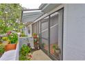 Inviting screened entrance with plants, leading to a well-maintained home at 2417 Locksley St # 229, Sun City Center, FL 33573