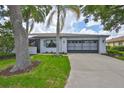 Charming single-story home with well-maintained landscaping and a spacious two-car garage at 2417 Locksley St # 229, Sun City Center, FL 33573