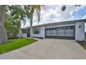 Charming single-story home with well-maintained landscaping and a spacious two-car garage at 2417 Locksley St # 229, Sun City Center, FL 33573