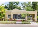 Charming single-story home featuring a stucco exterior, inviting porch, and attached carport for convenient parking at 3611 W Bay To Bay Blvd, Tampa, FL 33611