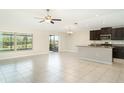 Open kitchen featuring modern stainless steel appliances, and ample countertop space at 9814 Quadrangle Ct, Sun City Center, FL 33573