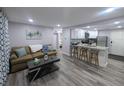 Inviting living room open to the kitchen features modern flooring and ample space for entertaining at 1028 E 93Rd Ave # A, Tampa, FL 33612
