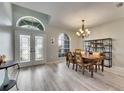 Bright dining area with stylish lighting, wood table, and beautiful window at 12904 Prestwick Dr, Riverview, FL 33579
