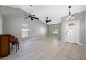 Spacious living room with high ceilings, tile flooring, and plenty of natural light at 14819 Redcliff Dr, Tampa, FL 33625