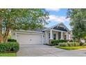 Well-maintained home with a spacious driveway and attached two-car garage at 15405 Woodstar Landing Ct, Lithia, FL 33547