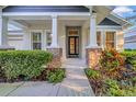 Beautiful entrance with a walkway and meticulously maintained landscaping at 15405 Woodstar Landing Ct, Lithia, FL 33547