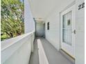 Exterior porch showing covered entry door and stairs leading up at 2254 Norwegian Dr # 22, Clearwater, FL 33763