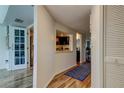 Hallway features views of the kitchen and dining room with stylish flooring and ample closet space at 318 Windrush Blvd # 10, Indian Rocks Beach, FL 33785