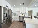 Modern kitchen with stainless steel appliances, white cabinetry, and stylish countertops at 321 42Nd S Ave, St Petersburg, FL 33705