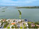 Beautiful waterfront property with a private dock, nestled among lush greenery, offering stunning views of the bay at 3290 Sunset N Dr, St Petersburg, FL 33710