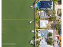 Aerial view of waterfront homes with private docks, highlighting property boundaries and access to open water at 3290 Sunset N Dr, St Petersburg, FL 33710