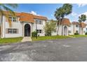 Exterior of building with parking spots and grass at 345 S Mcmullen Booth Rd # 142, Clearwater, FL 33759