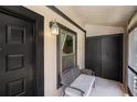 Covered porch with a bench, storage and a window, offering a cozy and functional outdoor space at 4014 Dream Oak Pl # 202, Tampa, FL 33613