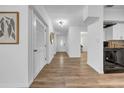Bright hallway with wood floors that leads to the front door and dining room at 8537 93Rd Ave, Seminole, FL 33777