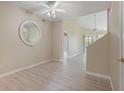 Spacious living room with light wood floors, neutral walls, and bright, natural light at 1050 Starkey Rd # 704, Largo, FL 33771
